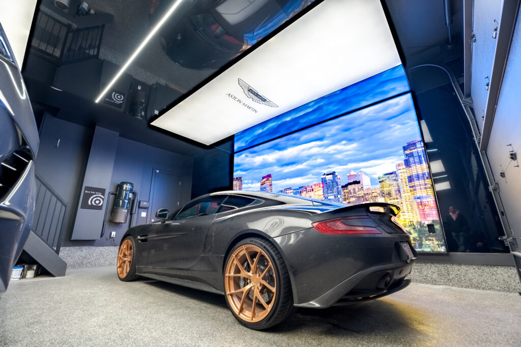 Maserati in a luxurious garage with ambient lighting, stretch ceilings, and modern design elements